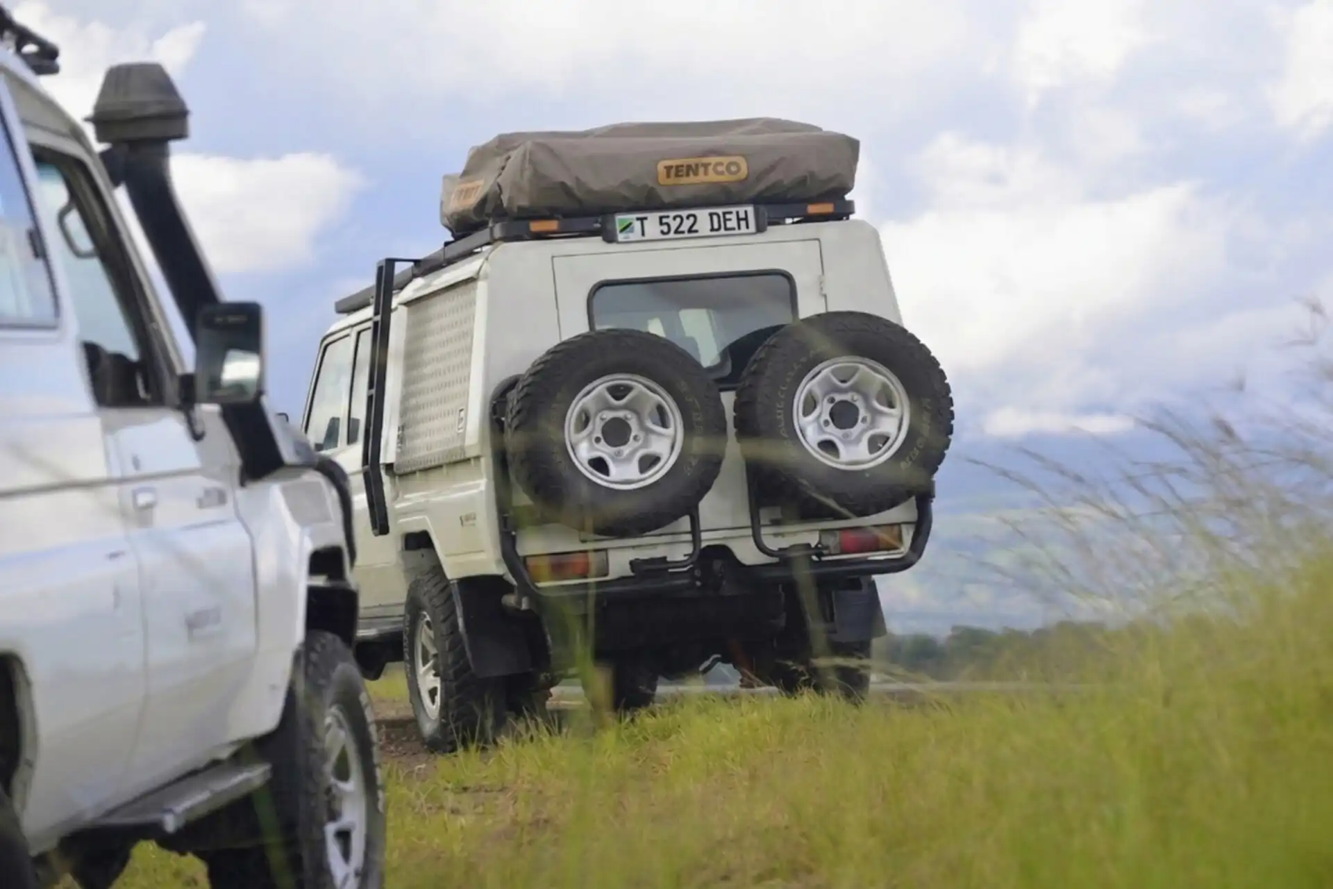 Self drive safari Land Cruiser camper exploring Serengeti National Park Tanzania